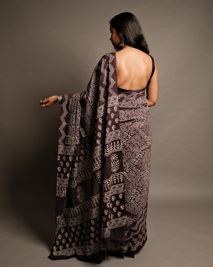 Model draped in the Wine Aesthetic Handblock Print Mul Cotton Saree by Cottons Daily, emphasizing its elegant geometric patterns.
