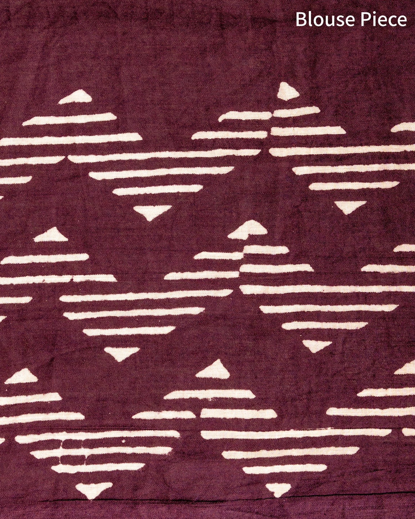 Detailed shot of the geometric print on the body of the Wine Aesthetic Handblock Print Mul Cotton Saree by Cottons Daily.
