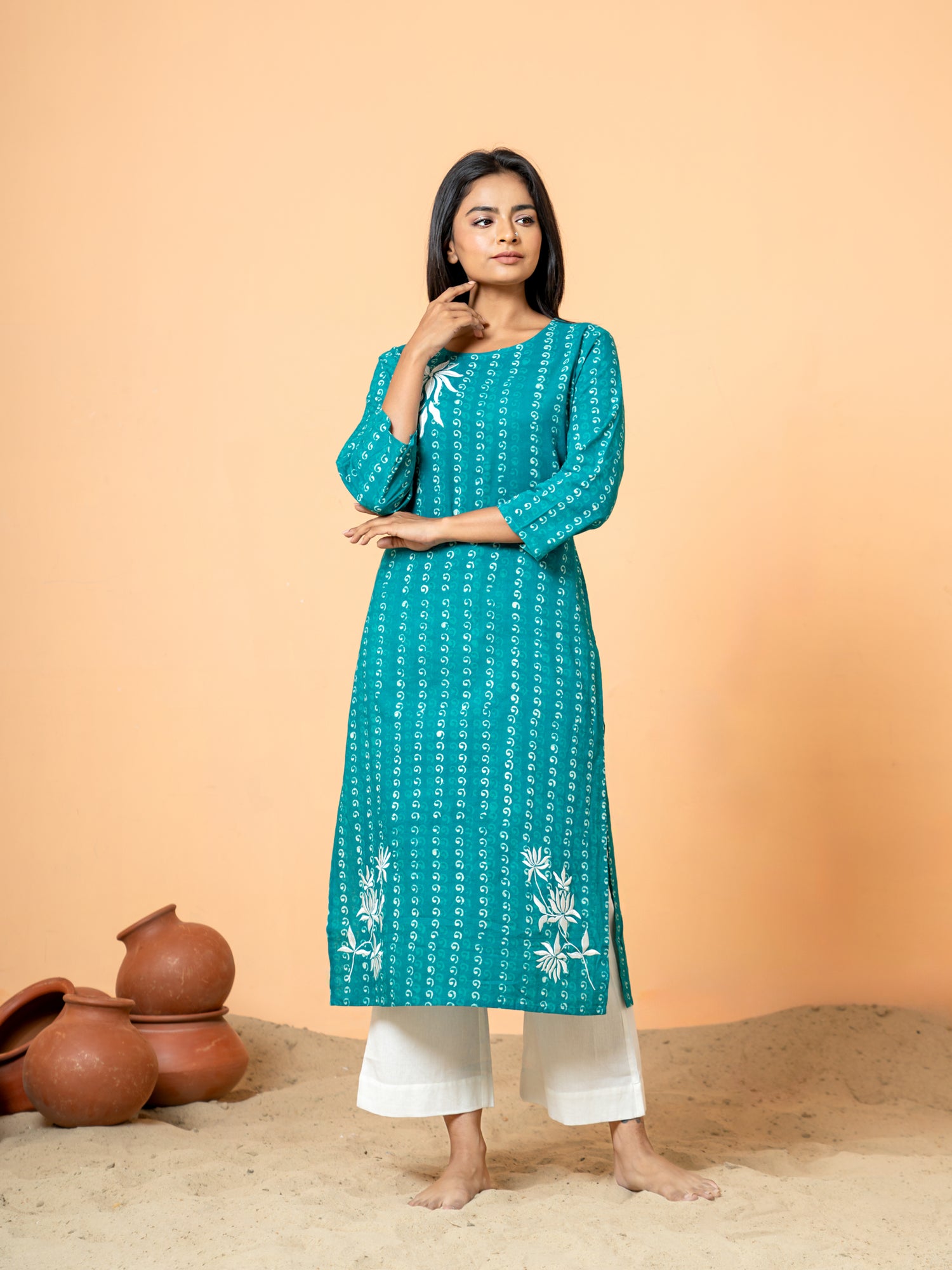 Full front view of the elegant Sea Green Pearl Work Cotton Kurta, displaying the beautiful sea green color and overall silhouette of the cotton fabric.