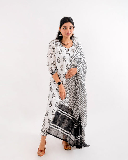 Front view of the Black & White Printed Cotton Suit from Cottons Daily, featuring a round-neck kurta with delicate mirror work and 3/4th sleeves.